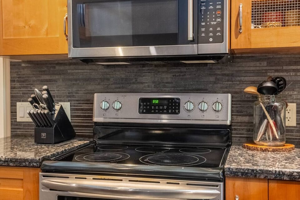 Full kitchen with drip & Keurig coffee makers, blender, Insta Pot, and essentials (ground coffee, tea, sugar, ketchup, mustard & relish.)