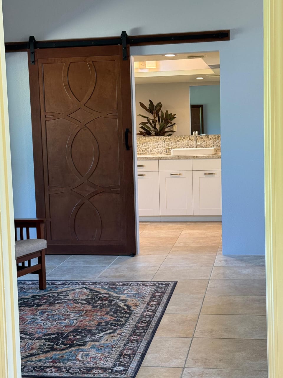 Barn door separating the Primary Suite from the bath.