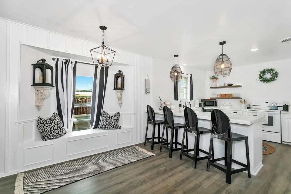 Get ready to cook up a storm in our charming farmhouse-style kitchen with bar seating, a cozy window nook, and an electric stove for easy meal prep. Book now for a comfortable and convenient stay!