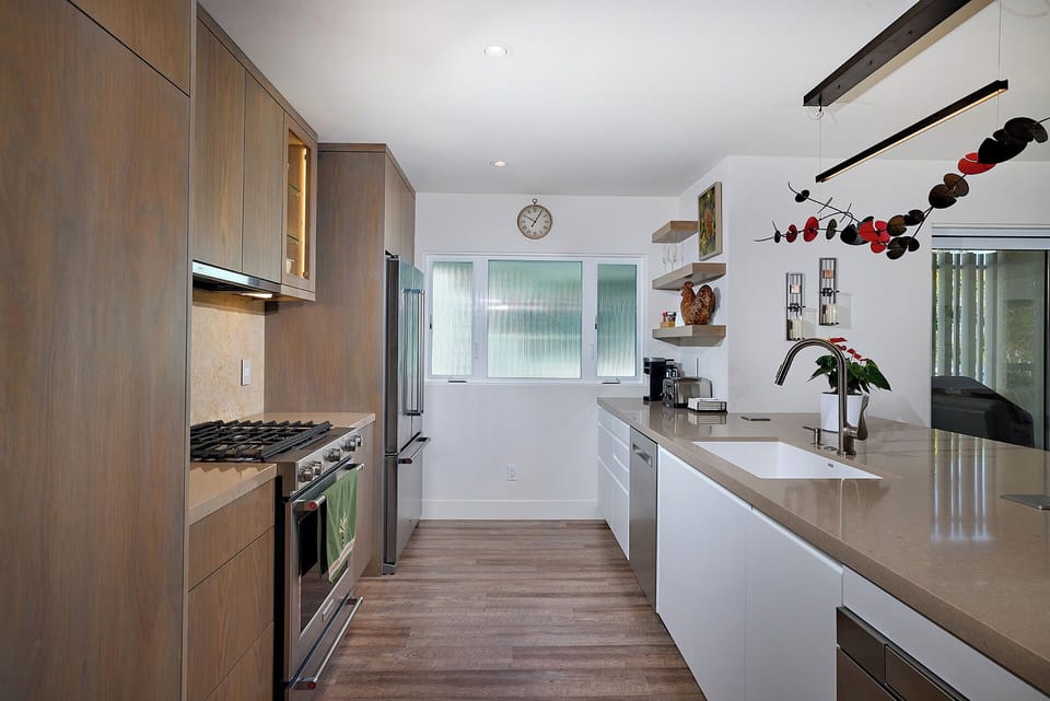 Modern kitchen fully stocked with upgraded appliances. 