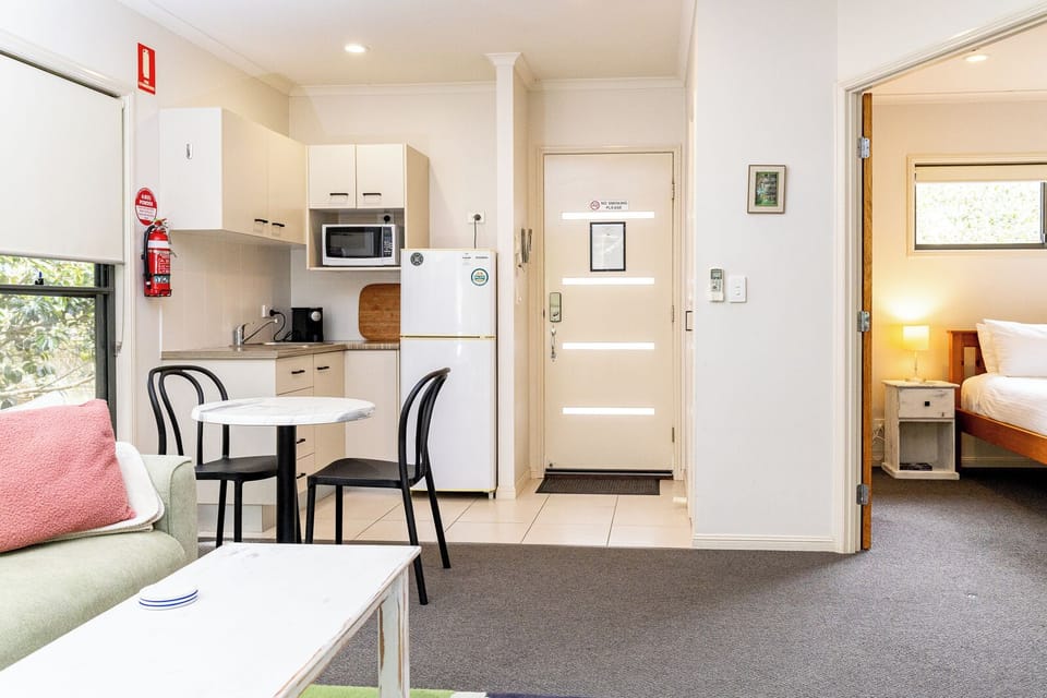 Living space, bedroom, kitchenette and sofa.