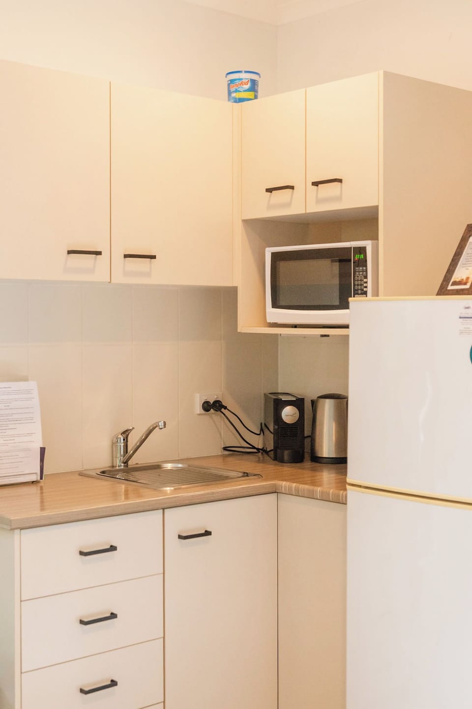 Kitchenette with Jug, Coffee Maker, Toaster and Microwave.