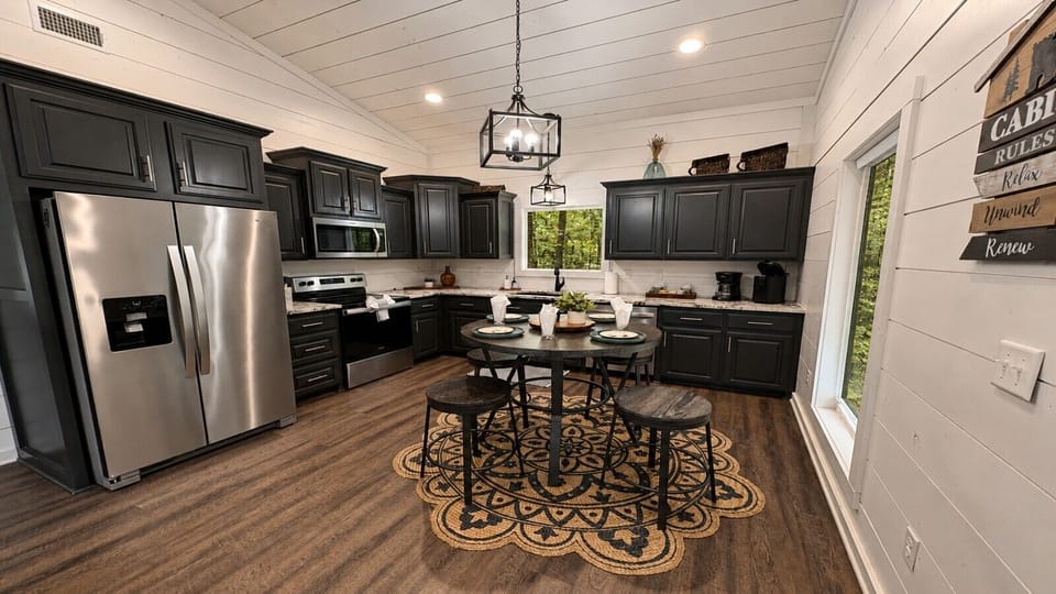 Modern Cabin Kitchen with Stainless Appliances & Dining Area