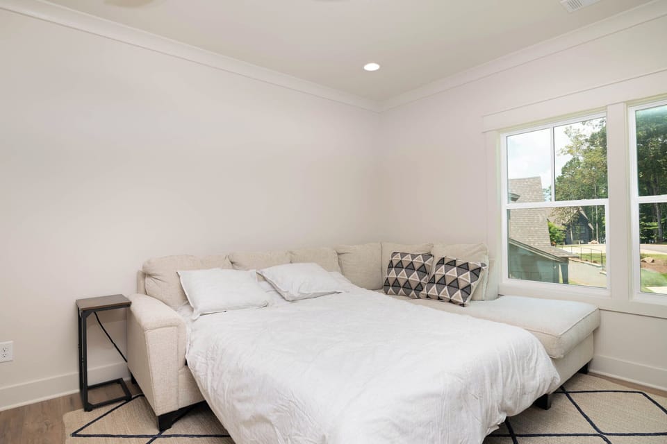Large sofa with chaise easily converts to queen sleeper sofa.