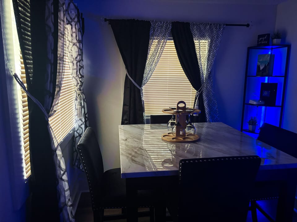 Dining room table along with wing glasses 