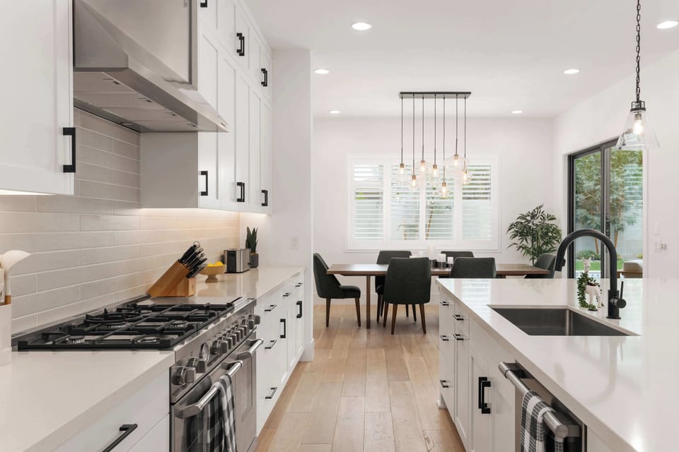Fully equipped kitchen with stainless steal appliances and a kitchen island with bar seating for 4 guests.