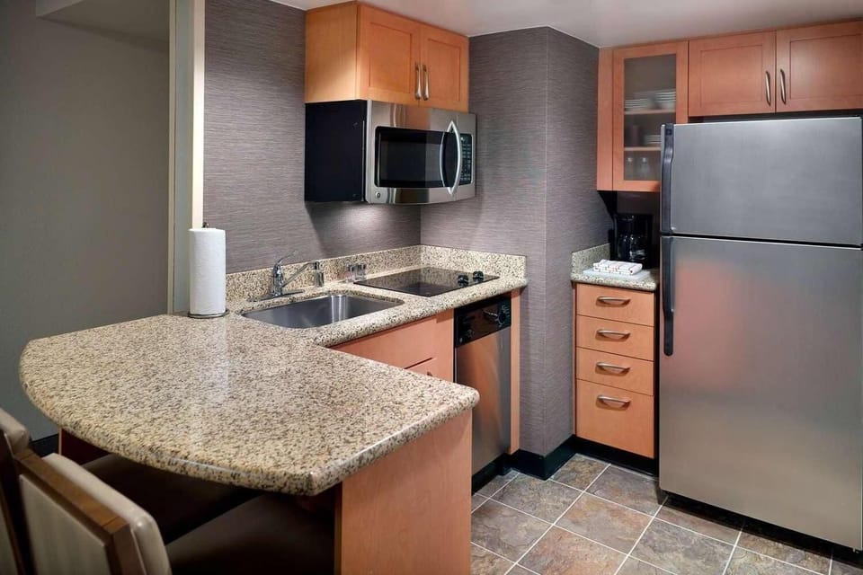 Cook easy meals in the sleek kitchenette with stainless appliances.