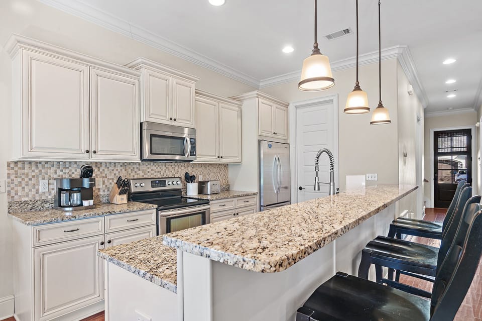 Stainless appliances and a roomy island make meal prep a breeze.