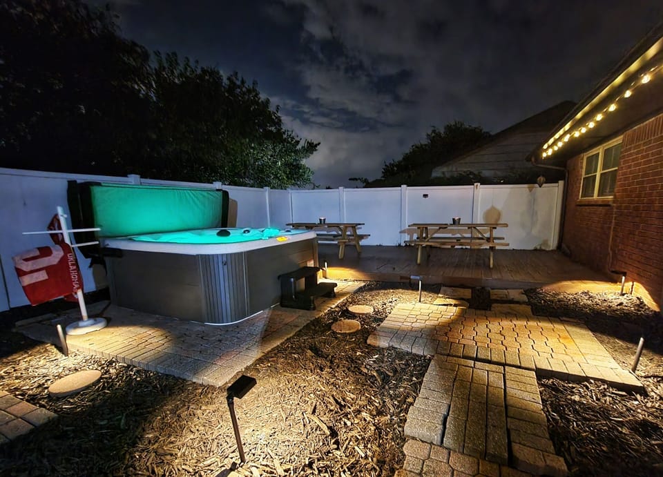 Hot tub, seating, and grill. This place has it all!