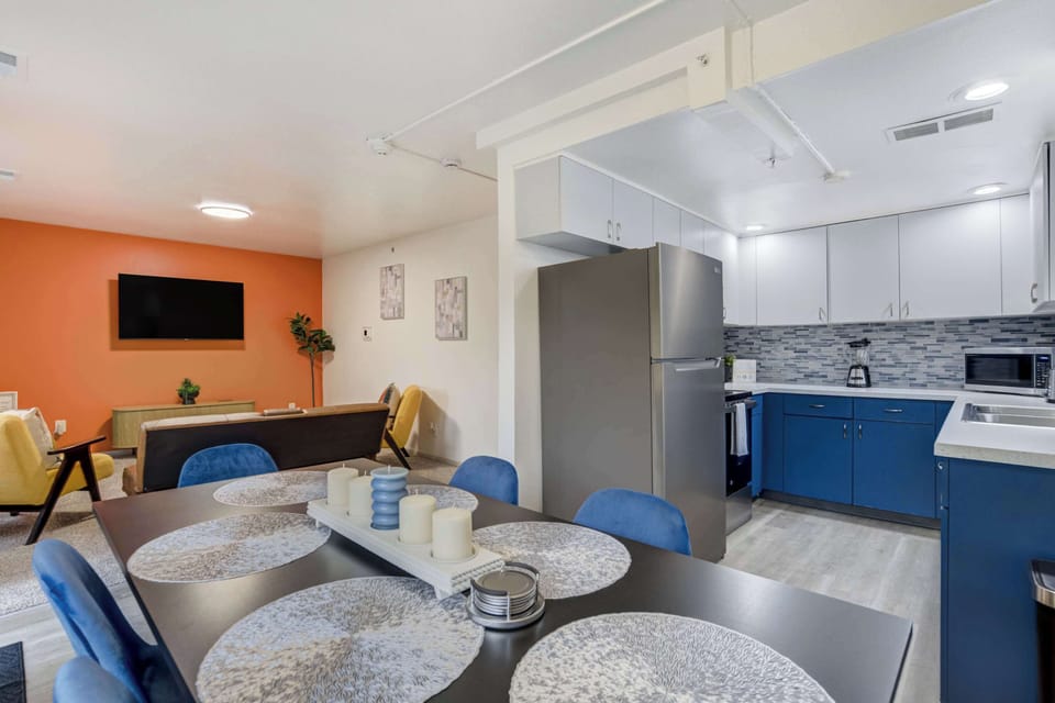 Open-concept design connecting the dining area, modern kitchen, and cozy living room, ideal for gathering with family and friends.
