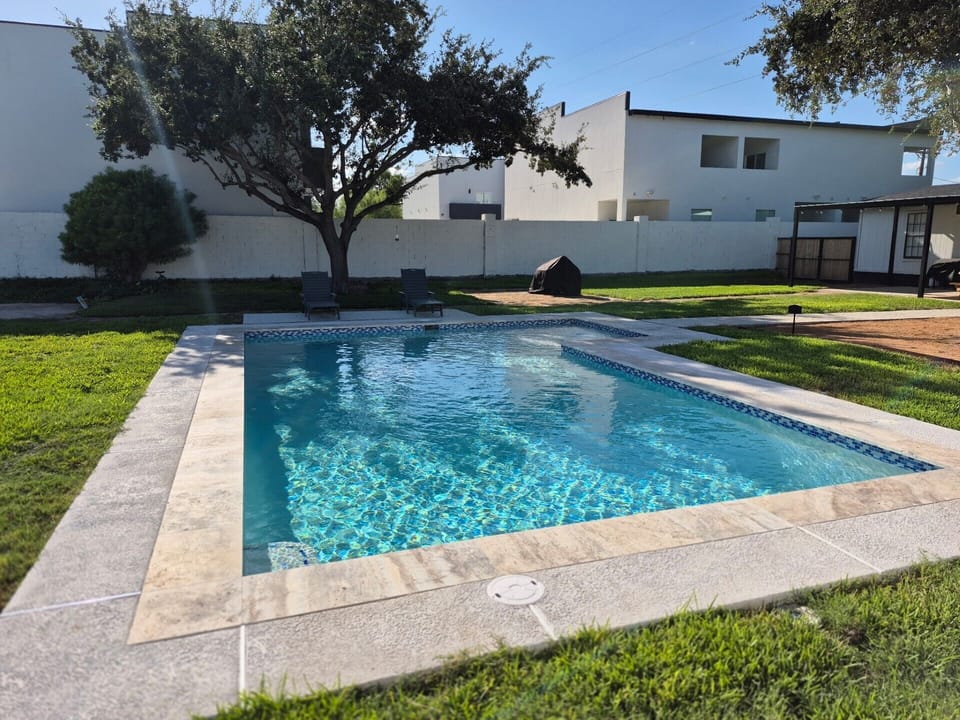 The large swimming pool offers sun during the day and shade in the afternoons.