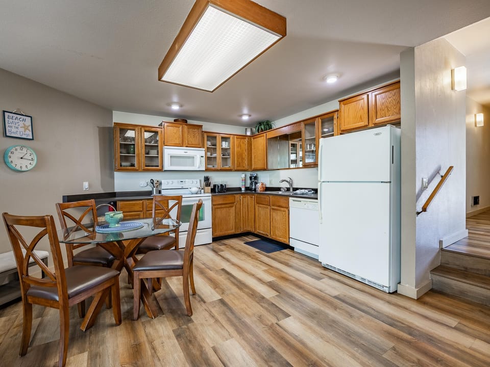 Bright, open kitchen and dining area with skylight glow