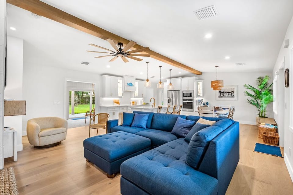 Stay a While, enjoy the open concept of this classic coastal property