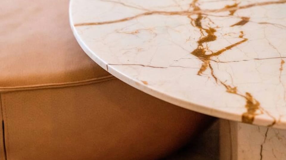 Marble and leather details bring calm sophistication to the space