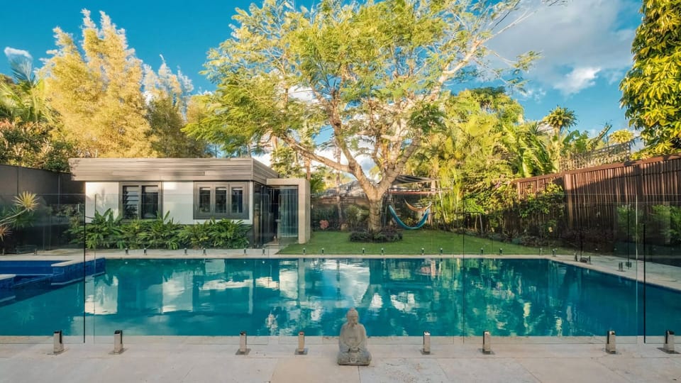Sparkling pool surrounded by tropical gardens