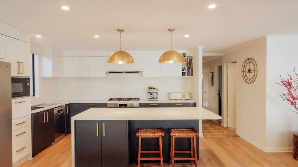 Fully equipped kitchen with statement lighting
