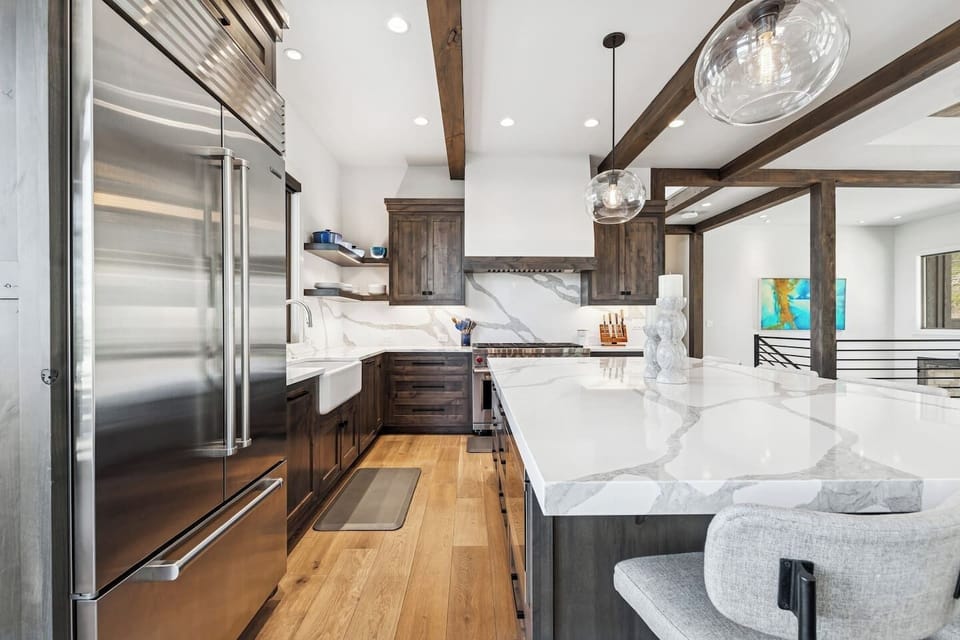 This luxurious kitchen is furnished with high end appliances and is uniquely designed.