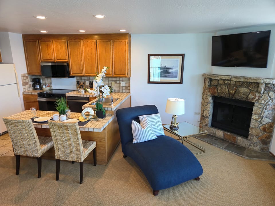 Kitchen and sitting area near gas fireplace