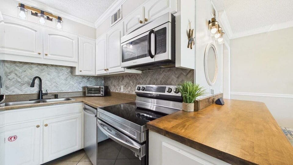 Full kitchen with stainless appliances and all the cooking essentials