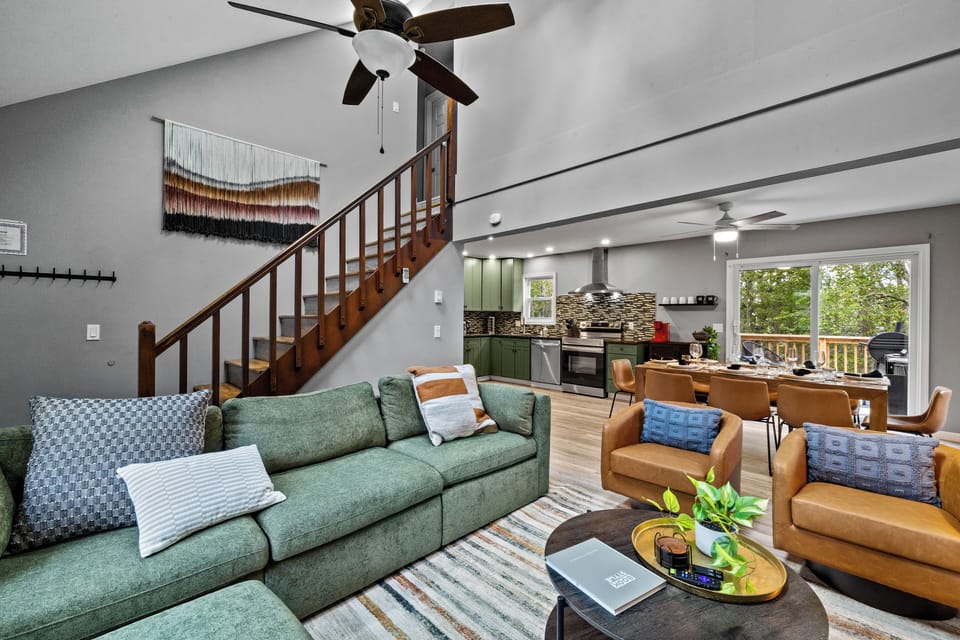 open concept living area with plush seating, modern decor, and natural light. 