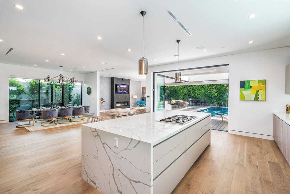 Tons of space, open flow with high ceilings! Gated & hedged for complete privacy