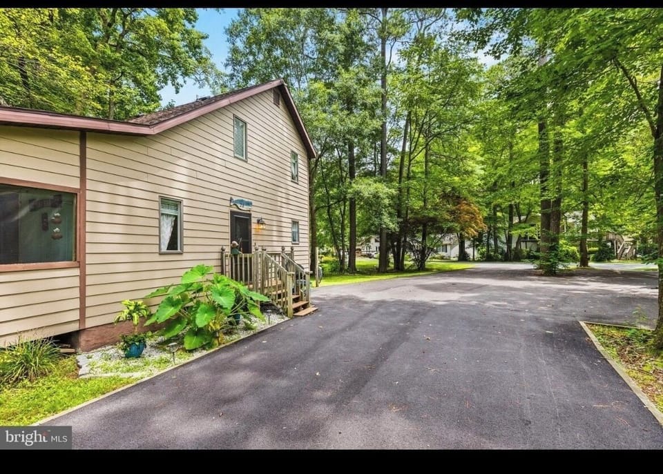 Salt Box style home with large driveway access