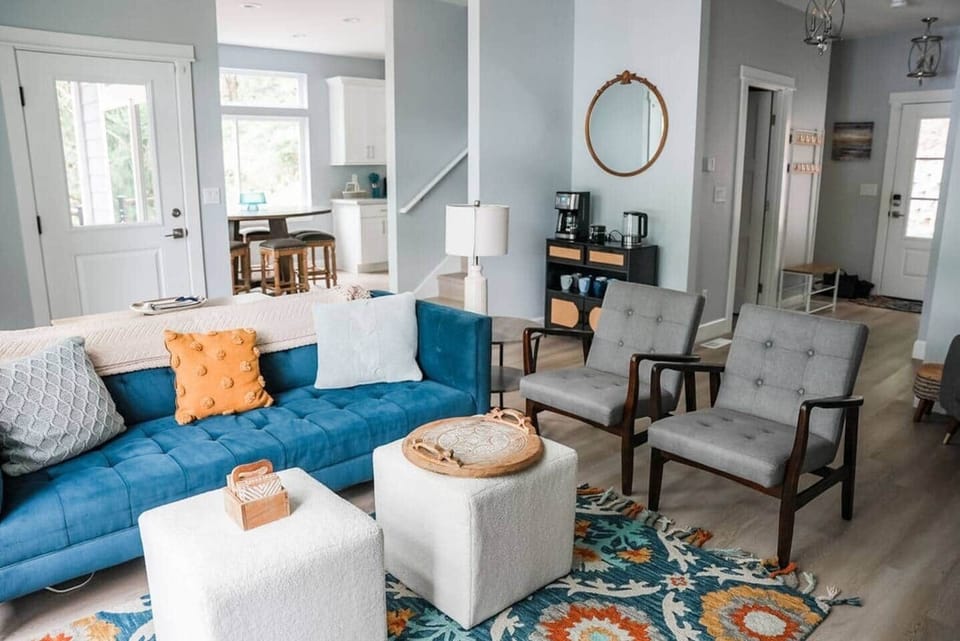 Living Room: Bright, chic space with vibrant decor and comfy seating invites relaxation and fun!