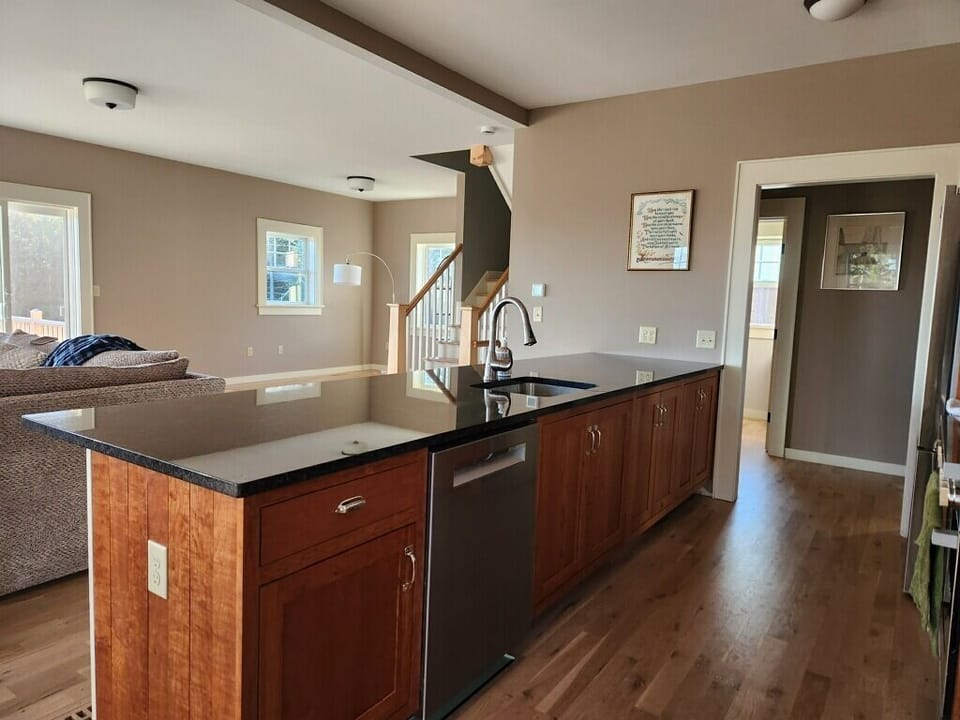 Kitchen island from dining room into kitchen and stairway