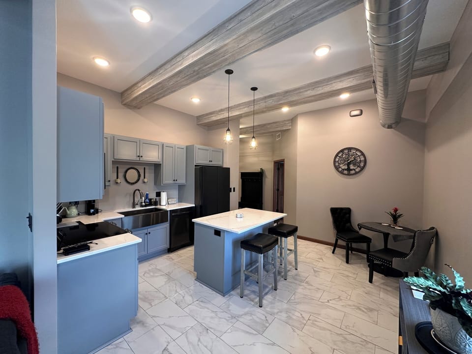 Fully stocked Kitchen with island and breakfast nook.