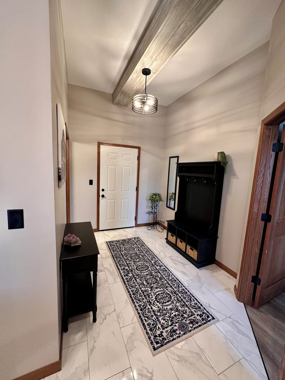 Welcoming entry with hall tree and console table.