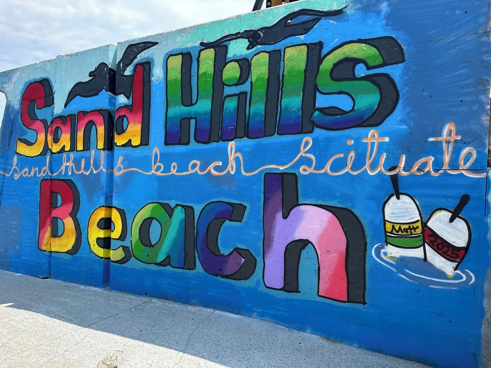 Steps from the entrance to Sandhills beach!