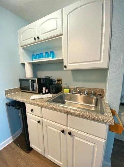 Newly furnished kitchen with microwave and refrigerator!