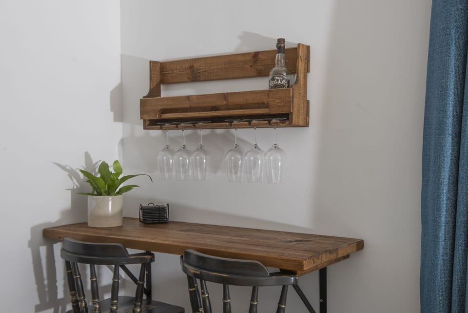 Bar area in the living room, with wine glasses- Sennen Sand by Stay Ca Holidays