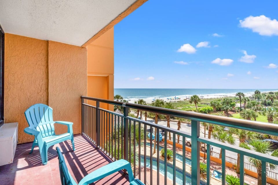 Gorgeous balcony with resort pool view and ocean view with an amazing visual of the Myrtle Beach skyline and sunset.