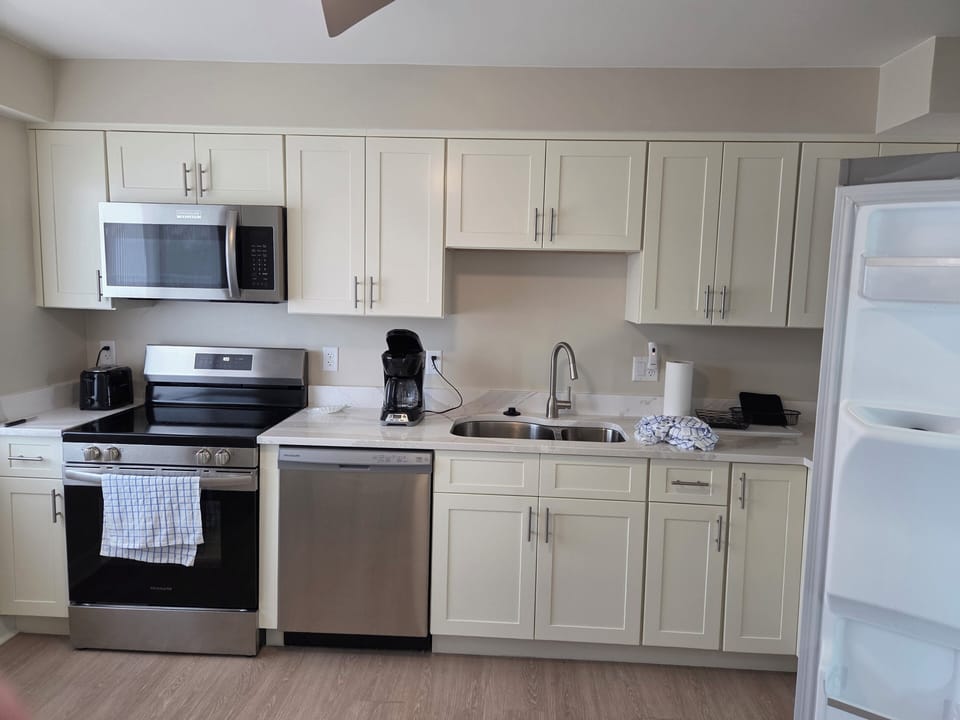 New kitchen with all new cabinets and appliances.  The kitchen is fully stocked.