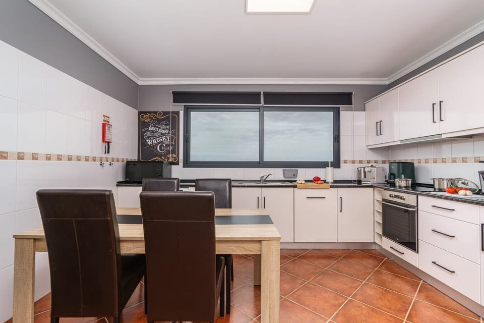 Bright and functional, this kitchen offers everything needed for easy dining with sea-view charm.