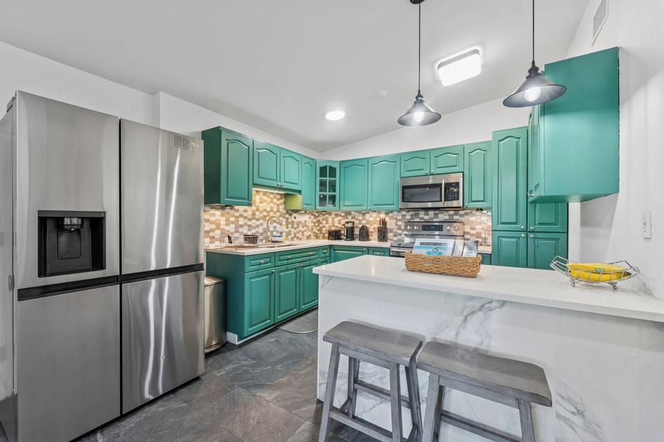 Fully equipped kitchen with breakfast nook plus dining area.