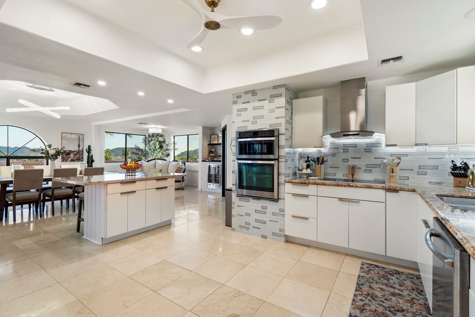 big open concept kitchen with high end appliances and space to work around