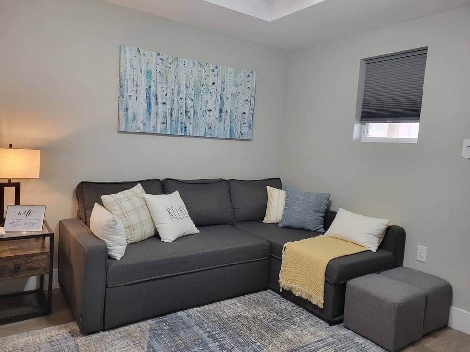 Spacious living area with convertible sofa sleeper.