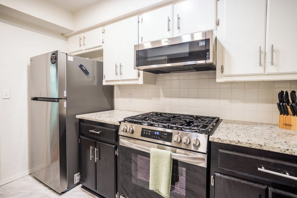 Fully stocked kitchen with gas stove and oven