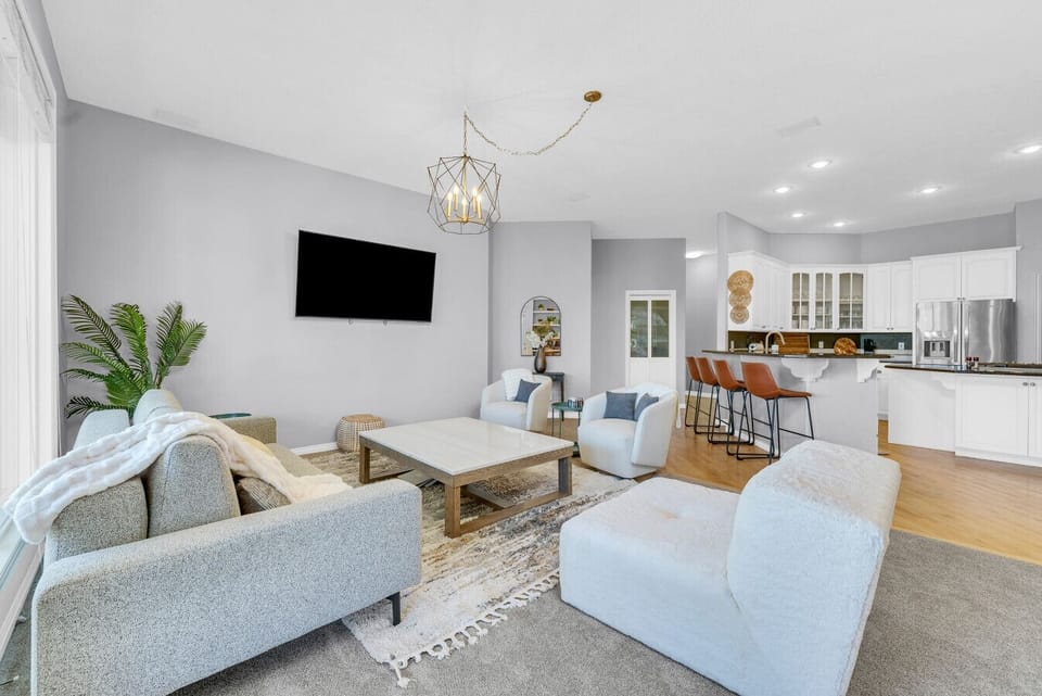 Relax in the open concept living room connected with kitchen and to large deck with views