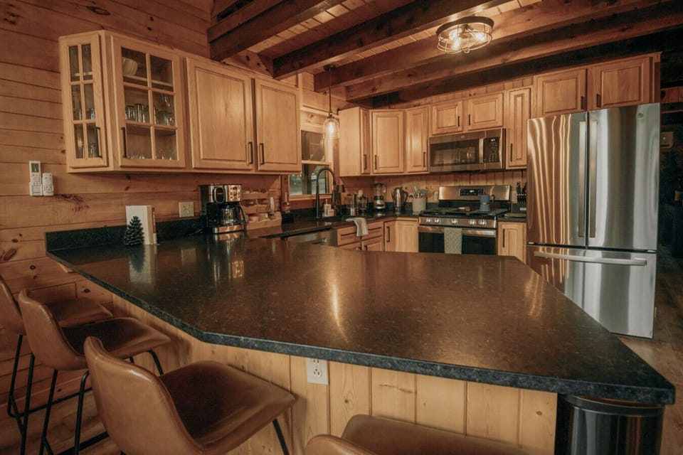 Open kitchen with bar stools