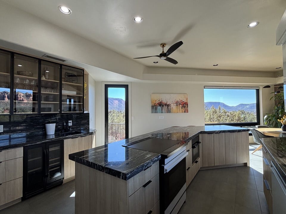 Window door to back patio and picture window viewing Mesas