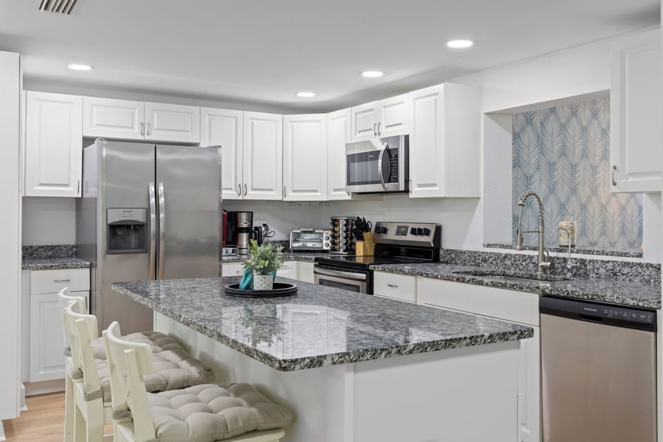 Large island includes 3 bar stool seats. Keep company while you cook!