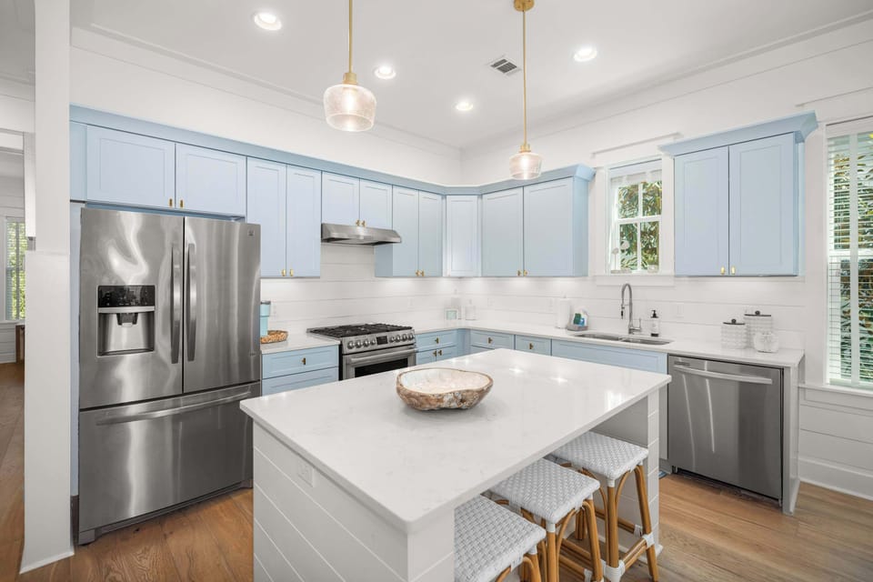 Kitchen: Main floor, drip coffee maker, Keurig, blender, toaster, cooking utensils, tableware