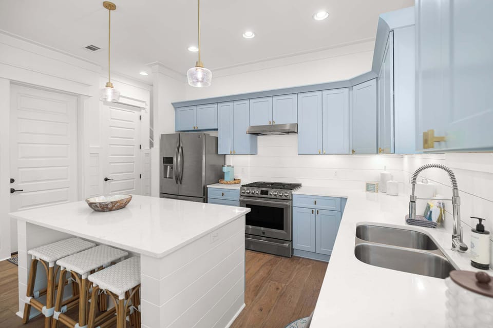 Kitchen: Main floor, drip coffee maker, Keurig, blender, toaster, cooking utensils, tableware