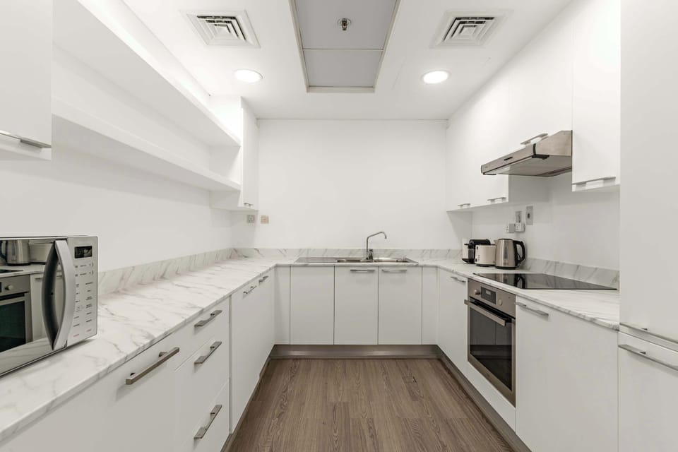 Sleek kitchen w/ bright counters & room to prep your favorites