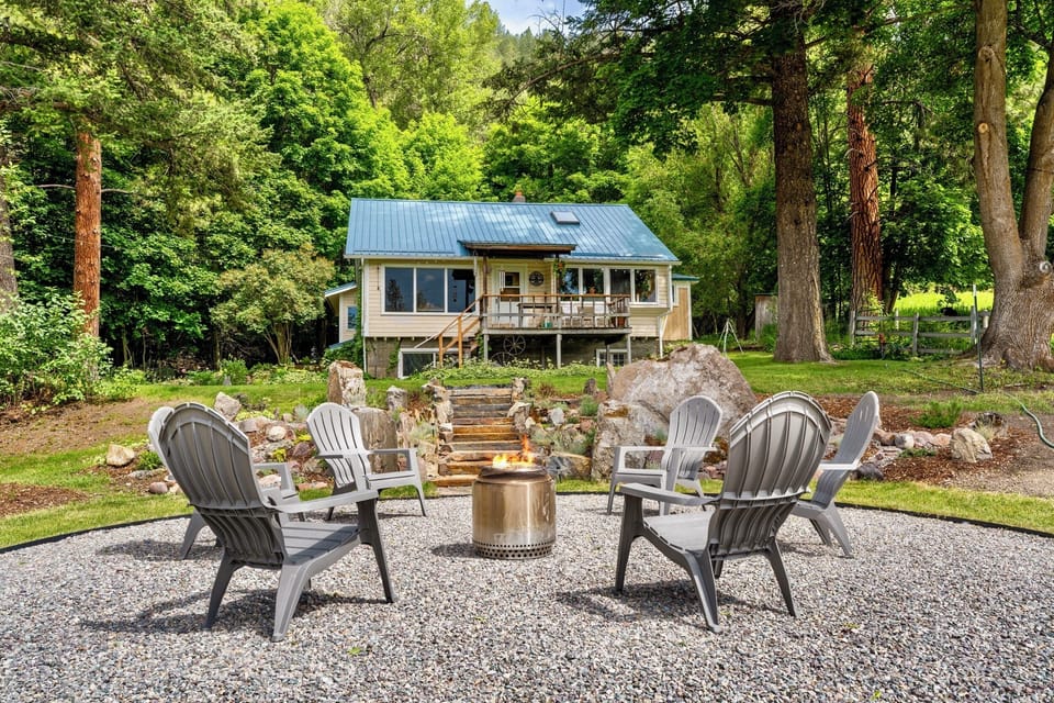 outdoor seating around fire pit in front of home