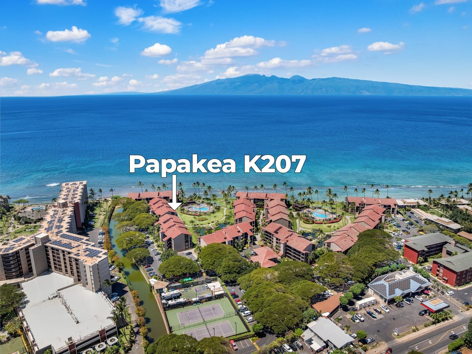 Panoramic aerial shot of Papakea K207 beachfront paradise.