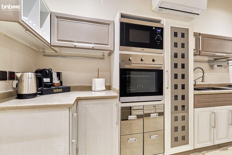Kitchen: "Prepare delicious meals with ease in our fully equipped kitchen, complete with modern appliances and ample space for culinary adventures."